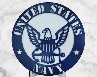 May include: A blue and white wooden sign with the words "United States Navy" and a stylized eagle with an anchor.