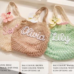 May include: Three personalized net bags in beige, brown, and watermelon colors. Each bag has a different name embroidered in white: "Ser", "Olivia", and "Lily". The bags are decorated with floral accents.