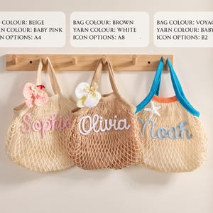 May include: Three personalized net tote bags in beige, brown, and voyage colors, each with a different name embroidered in a contrasting yarn color. The bags are decorated with floral accents and a starfish.