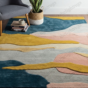 Hand-tufted wool rug with abstract landscape design