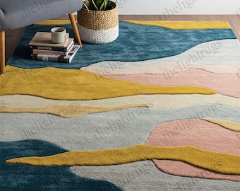 Puede incluir: Alfombra de área abstracta con un esquema de color azul, amarillo, rosa y crema. La alfombra presenta un diseño ondulado y abstracto.