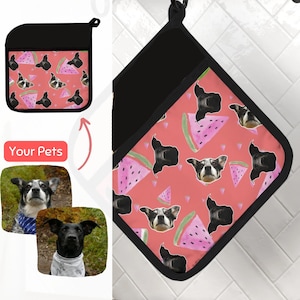 May include: A pink and black oven mitt with a watermelon pattern. The watermelon slices have images of dogs on them. The text "Your Pets" is on the mitt.