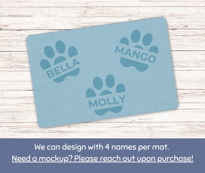 May include: A light blue rectangular pet mat featuring three paw prints with the names "BELLA", "MANGO", and "MOLLY" printed inside. The text "We can design with 4 names per mat" is at the bottom.