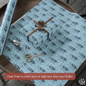 May include: Light blue wrapping paper featuring a repeating pattern of dog faces, Christmas trees, and stockings with the text Happy Holidays. A rectangular gift box is wrapped in the paper with a brown ribbon and a pair of metal scissors.