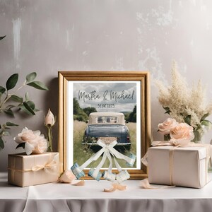 Charming wedding gift showcased in a wooden frame – a poster featuring wedding cars adorned with banknote-made cans. There are two gifts on both sides of frame as decoration.