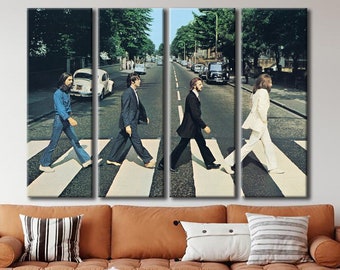 May include: A four-panel canvas print featuring a black and white photo of the Beatles walking across a zebra crossing. The photo is a classic image of the band, and the print is a great way to add a touch of pop culture to your home decor.