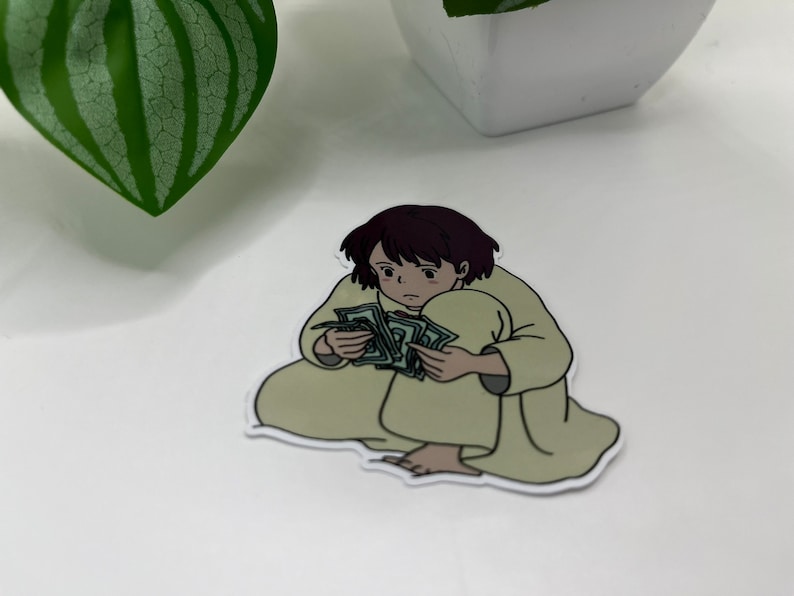 May include: A sticker of a cartoon person sitting with a large stack of money in their lap.