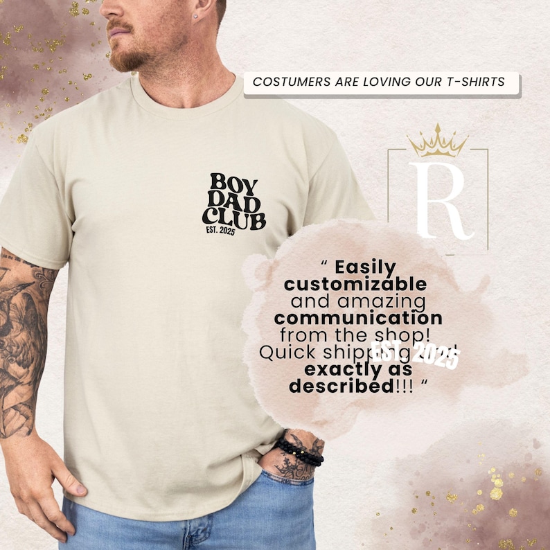 May include: A beige t-shirt with the text "BOY DAD CLUB EST. 2025" in black. The shirt also has the text "COSTUMERS ARE LOVING OUR T-SHIRTS". A customer review is also visible.