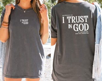 May include: A gray t-shirt with the text "I Trust in God" on the front and "Deuteronomy 31:8 I Trust in God My Savior One, Who Will Never Fail" on the back.