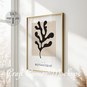 以下が含まれることがあります： ベージュの背景に、スタイリッシュな葉の黒いシルエットが描かれた、金色の額縁付きのプリント。プリントの下には「No. 06 BOTANIQUE」というテキストがあります。