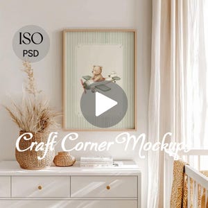 May include: A framed nursery art print with a watercolour illustration of a teddy bear in a biplane. The artwork has a soft colour palette and a striped background. The frame is light wood. The text "Craft Corner Mockups" is at the bottom.