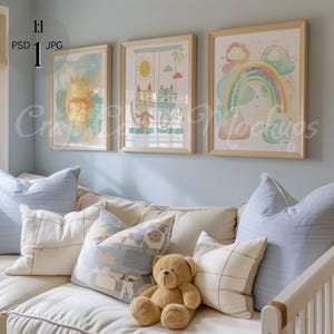 May include: Three framed illustrations in a nursery setting. The illustrations are of a sun, a rainbow, and two cats on swings. The frames are light wood and the illustrations are in pastel colors.