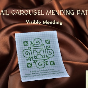 May include: A square mending patch with a green snail carousel design, perfect for visible mending. The patch is on a grid background and features the text "SNAIL CAROUSEL MENDING PATCH" and "Visible Mending".