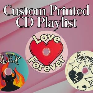 May include: Three custom printed CD designs. One features a heart with the text "Love Forever", another has a devil with flames and the text "Alex", and the last one has a broken heart, a paper airplane, a cat, and the text "Aurelia".
