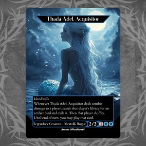 Op de afbeelding: Een fantasy trading card met een blauwe en witte zeemeermin met lang, golvend haar. De kaart is getiteld "Thada Adel, Acquisitor" en heeft de tekst "Islandwalk" en "Legendarisch Wezen - Merfolk Rogue 2/2".