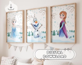 May include: Three digital printable wall art prints featuring characters from the movie Frozen. The prints are in a watercolor style and feature Elsa, Anna, and Olaf. The prints are framed in a light wood frame.