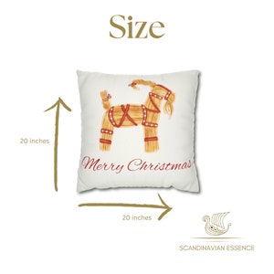 May include: A white throw pillow with a straw goat illustration and the text "Merry Christmas". The pillow is 20 inches by 20 inches.