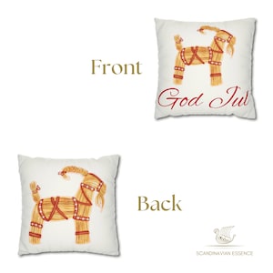 May include: A white pillow with a straw goat illustration on the front and the text "God Jul" in red. The back of the pillow has a straw goat illustration and a logo that says "Scandinavian Essence".