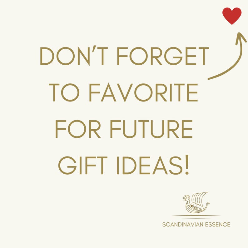 May include: A gold text graphic on a white background with a red heart and arrow pointing to the text. The text reads "Don't forget to favorite for future gift ideas!" with a gold Viking ship logo below the text and the words "Scandinavian Essence".