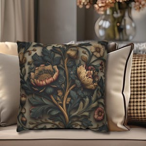 May include: A decorative throw pillow with a floral pattern featuring large, stylized flowers in shades of peach, yellow, and green on a dark background. The pillow is placed on a beige sofa with other pillows, creating a cozy and inviting atmosphere.