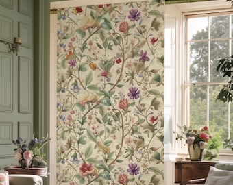 May include: A room with a floral patterned window treatment. The design features a cream background with colorful flowers and green leaves. The room has a sofa, chair, and a wooden table. The walls are painted a light green color.