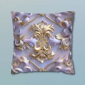 May include: A square throw pillow with a white background and a gold and white ornate design. The design features intricate floral patterns and swirls.