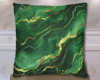 May include: A square throw pillow featuring a deep emerald green marbled pattern with flowing gold veins and scattered gold flecks across the surface. The design mimics the appearance of polished stone with smooth, wavy lines in varying shades of green.