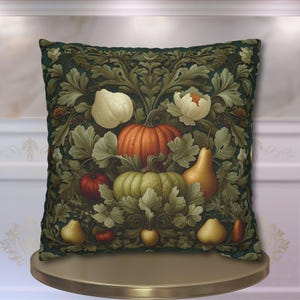 May include: Decorative square pillow featuring a botanical design with pumpkins, pears, and flowers in shades of orange, green, and white. The pillow has a dark green background with a detailed floral pattern, creating a fall harvest theme.