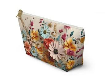 Zubehörbeutel mit lebendigem, mehrfarbigem Blumenwiese-Design auf cremefarbenem Hintergrund. Alltagsorganisation für die Handtasche oder als Reisegeschenk für Mama