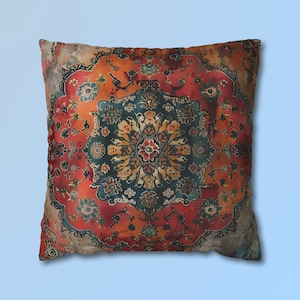 May include: A decorative throw pillow with a colorful, intricate pattern reminiscent of a Persian rug. The pillow features a central medallion with floral motifs in shades of red, orange, blue, and green, surrounded by a border of smaller floral designs.
