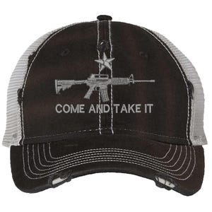 May include: A black baseball cap with a distressed brim and grey mesh back panels. The front features an embroidered grey graphic of a rifle positioned below a star, with the text COME AND TAKE IT stitched in grey lettering beneath the rifle.
