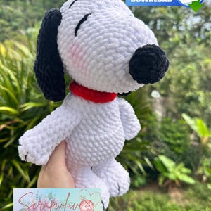 May include: A handmade white and black plush dog with a red collar. The dog has closed eyes and a black nose. The image includes the text "PDF FILE DOWNLOAD" and the logo "Scrapfave Creations".