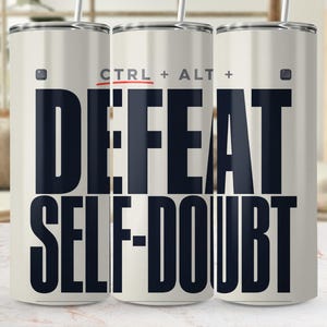 May include: A cylindrical stainless steel tumbler with a white finish and a metal straw. The design features the black text "CTRL + ALT + DEFEAT SELF-DOUBT" printed in a bold, sans-serif font, with a small red underline beneath the word CTRL.