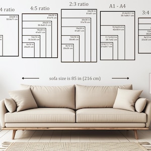 May include: A beige sofa with two pillows is positioned below a wall displaying various black framed print sizes, including 11x14 in, 16x20 in, and 24x36 in. The text indicates the sofa is 85 inches (216 cm) wide. A small table and rug are also visible.