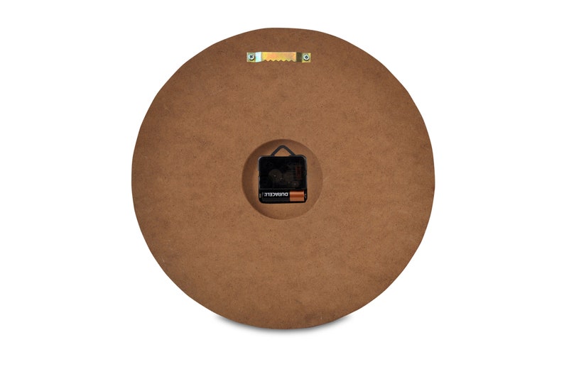 May include: The back of a round wooden clock with a battery compartment and a hanging hook.