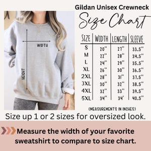 May include: A light grey Gildan Unisex Crewneck sweatshirt with a size chart. The chart displays measurements in inches for width, length, and sleeve length, from size S to 5XL. The text advises sizing up for an oversized fit.
