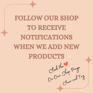 May include: A pink background with a white border and a text overlay that reads "FOLLOW OUR SHOP TO RECEIVE NOTIFICATIONS WHEN WE ADD NEW PRODUCTS".  The text is in a brown font.  Below the text is a handwritten message that reads "Click the On Our Shop Page Clover and Tay".  A red heart is drawn next to the word "Click".