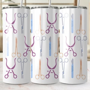 May include: Three stainless steel tumblers with a white background and a pattern of various medical instruments in shades of purple, blue, and orange.