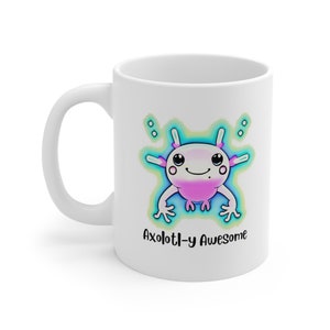 May include: White ceramic mug with a cartoon axolotl illustration. The axolotl is pink and blue with a light blue background. The text "Axolotl-y Awesome" is printed below the axolotl.