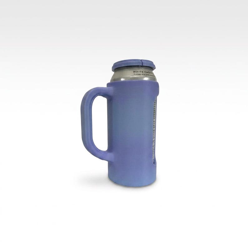 May include: A blue can cooler with a handle, designed to hold a standard-sized beverage can. The cooler is a gradient of blue hues, with a handle for easy carrying. The top of the can is visible, with text printed on it.