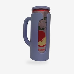 May include: A light purple can cooler with a handle, holding a can of Crisp Apple energy drink. The can features a red apple graphic. The cooler is designed to keep beverages cold and is made of a durable material.