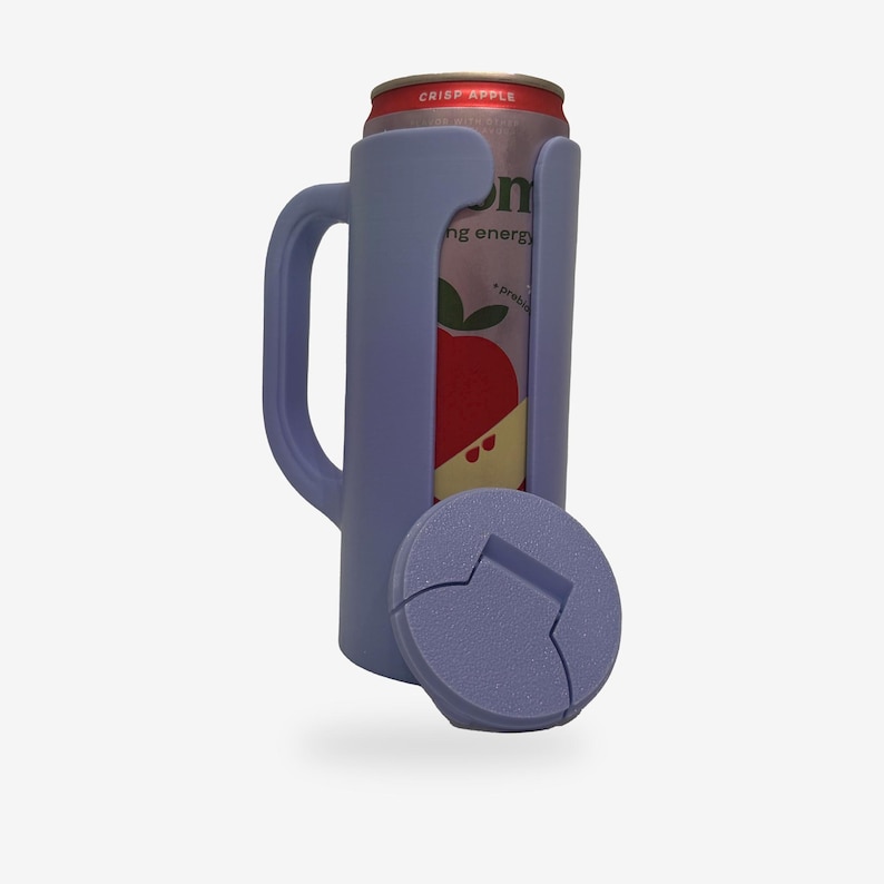 May include: A light purple can cooler with a handle, holding a can of Crisp Apple beverage. The cooler has a matching lid with a bottle opener design. The can features a red apple graphic.