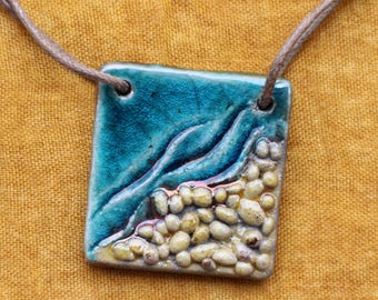 Raku ceramic pendant, honey and turquoise colors