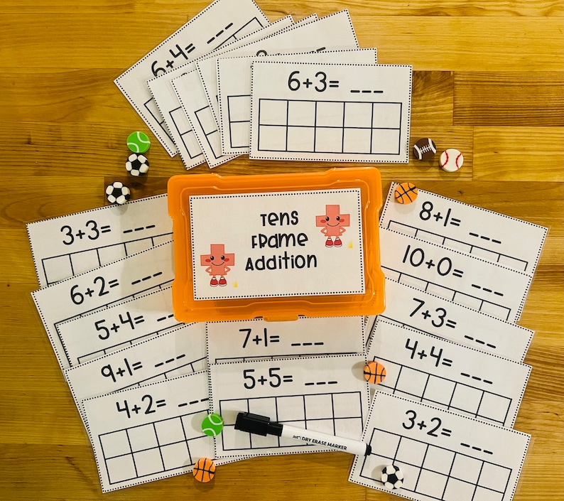 May include: A set of printable math worksheets for kids featuring a tens frame addition theme. The worksheets include addition problems with sums up to 10. The worksheets are printed on white paper and have a black and white design. The worksheets are in a plastic container with a red and white design.