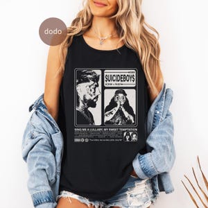 May include: Black tank top featuring a graphic design with the text "$UICIDEBOY$" and the words "SCRIM + RUBY". The design includes two portraits and the phrase "SING ME A LULLABY, MY SWEET TEMPTATION".