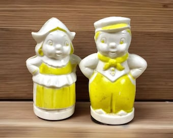 Antike Salz- und Pfefferstreuer aus Zelluloid | Gelbe Holländer Junge und Mädchen