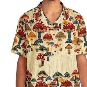 May include: A short-sleeved button-down shirt with a beige background and a colourful mushroom print.