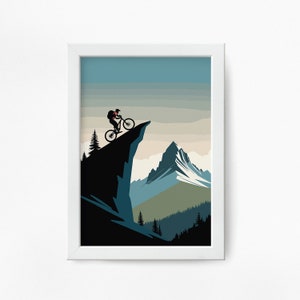 May include: A silhouette of a person riding a mountain bike on a cliff overlooking a snow-capped mountain range. The sky is a gradient of blue, white, and orange.
