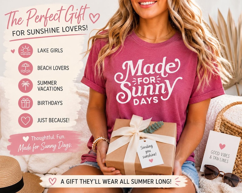 May include: A dark pink short-sleeved t-shirt with white text that reads Made for Sunny Days. The shirt is paired with a brown gift box tied with a white ribbon and a tag that says Sending you sunshine with a small pink heart icon.
