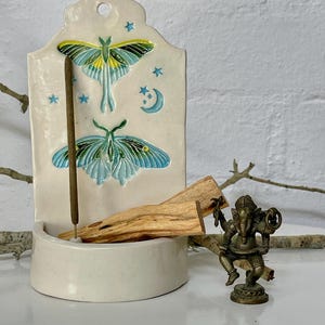 handmade white stars, moon and moth ceramic flower and incense holder, shelf, altar, shrine